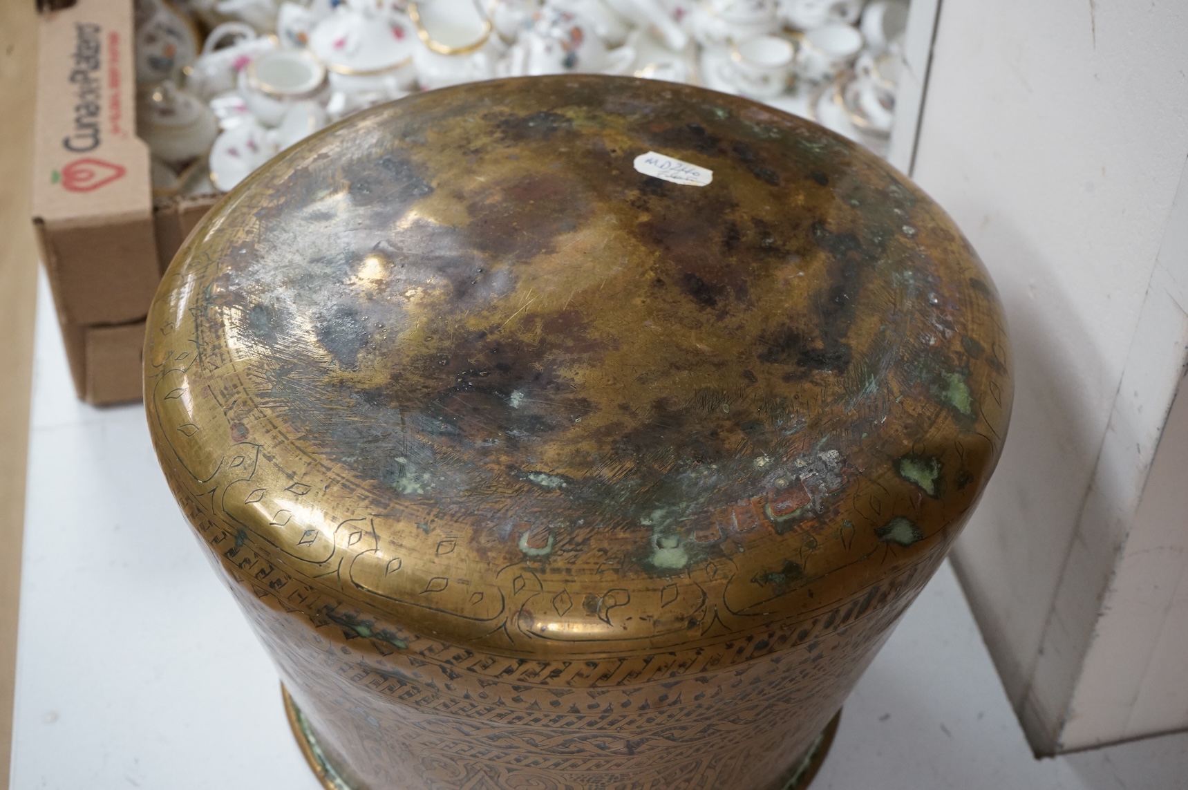 A Syrian Islamic copper vessel with detailed surface engraved pattern, 19cm high